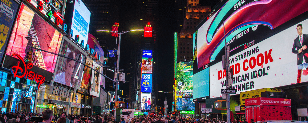 traditional marketing vs digital marketing - view of billboards and signage in a busy city